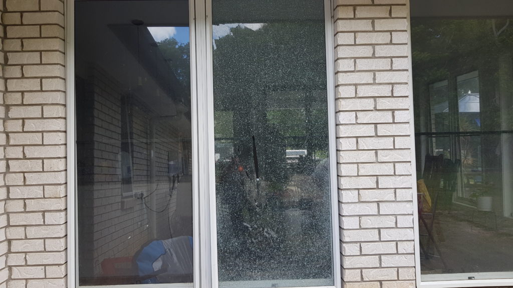 Large aluminum awning window on right hand side has shattered due to an impact from the mower window
